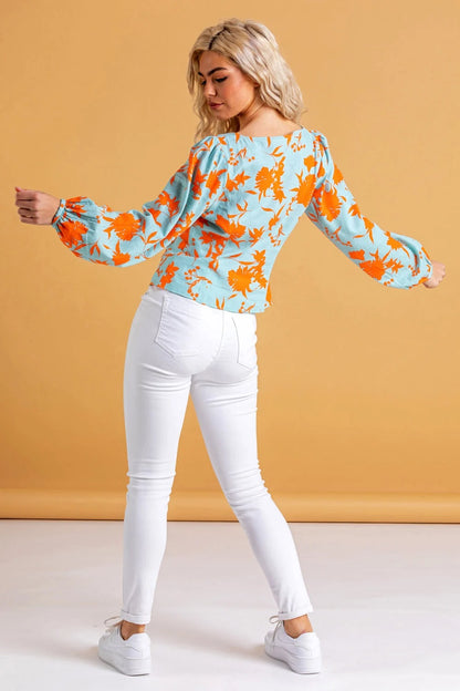 ROMA | Blusa con estampado floral y botones naranjas